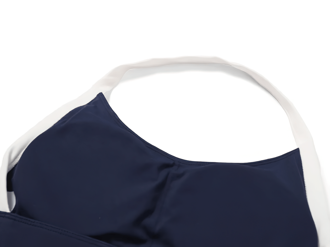 Close-up of Women's Sleeveless Yoga Top - SF2374, navy color with white trim, made of durable nylon and spandex, ideal for workouts.